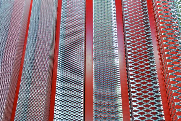 Close-up of red and silver metal mesh panels arranged in vertical rows